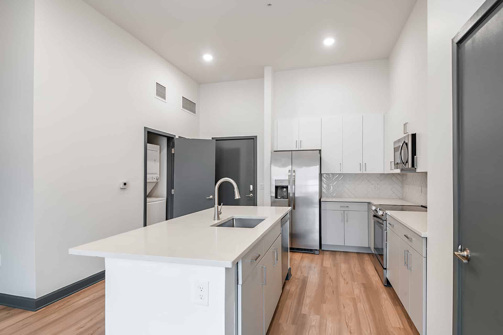 2 Bedroom - open concept kitchen showing laundry room