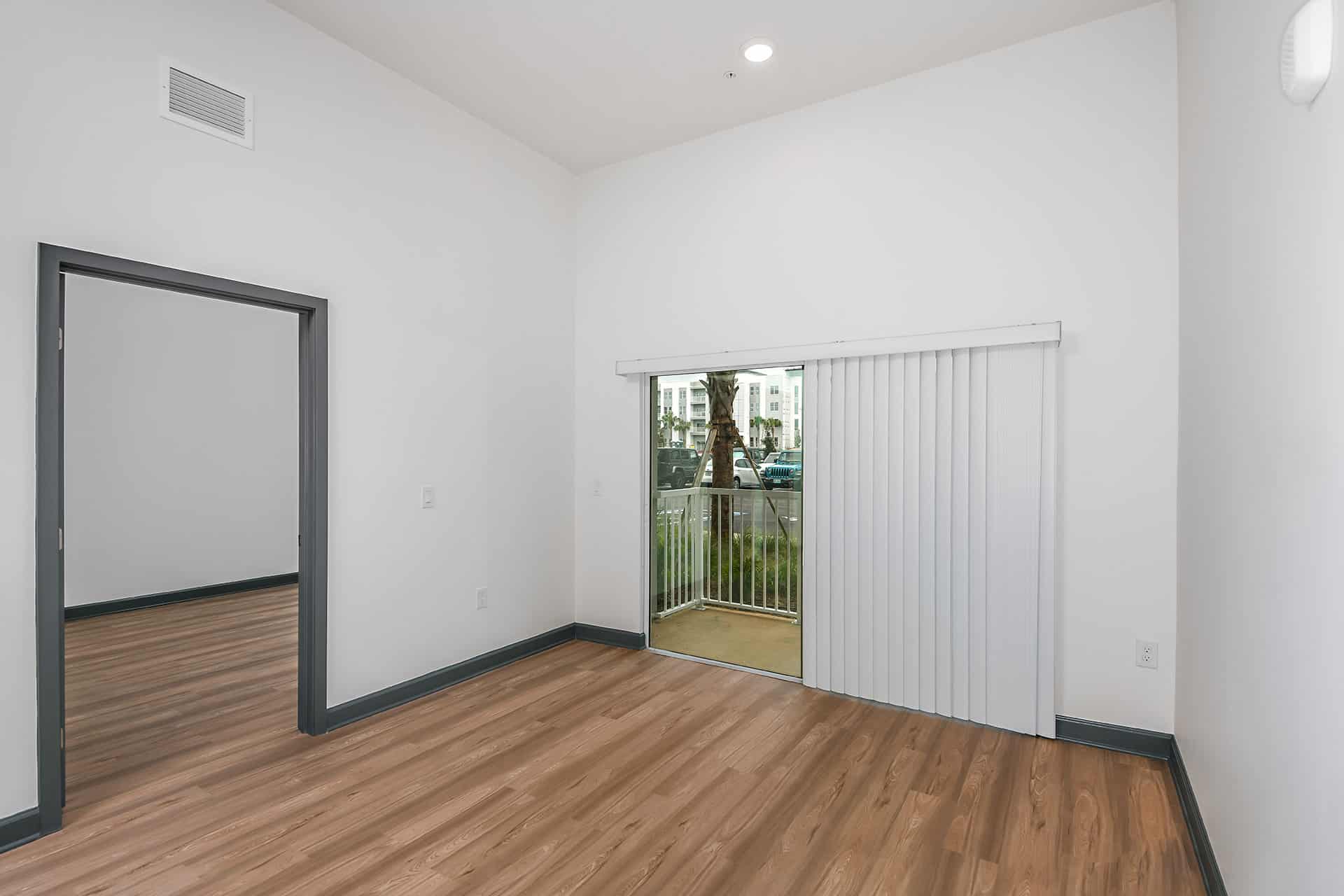 living room area with wood inspired flooring